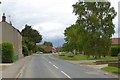 Weaverthorpe village street and stream