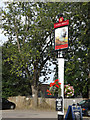 TL1413 : The Plough & Harrow Public House sign by Geographer