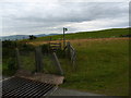 Cattle grid, stile and footpath sign