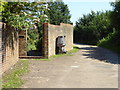 Gate and strange carving on footpath