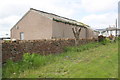 Wall beside Inglewood Road at Caravan Park near White Ox Farm