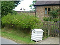 Recycled beehive as a letterbox