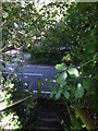 Footpath reaches Storrington Road down steps