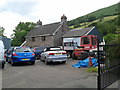 Cars, house and hills