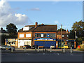 SE2533 : Shops on the corner of Pudsey Road and Henconner Lane by Stephen Craven