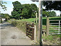 Stile and signpost on Sowerby Bridge FP93, Norland