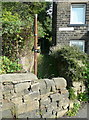 Stile and signpost on Sowerby Bridge FP78 at Harper Royd Lane, Norland