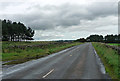 NZ0591 : Country road near Nunnykirk (2) by Stephen Richards