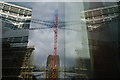 View of the Tate Modern chimney and scaffolding reflected in the Blue Fin building #3