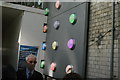 View of coloured lights under the Southwark Street railway bridge