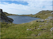 NH0441 : Lochan on the north ridge by Richard Law