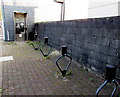 Bicycle racks and grey phonebox, Abersychan