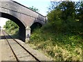 A blue brick bridge over the Great Central Railway