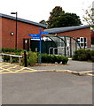 Signpost near bicycle racks in Newburgh Primary School, Warwick