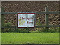 TM1164 : Cherrygate Farm sign by Geographer