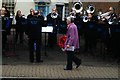 View of a third lady walking up to the memorial to lay a wreath at the Billericay Remembrance Sunday Service