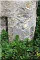 Weathered benchmark on buttress of Christ Church