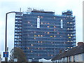 TQ2564 : Tower block under renovation on Chaucer Road by David Howard