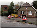 Temporary warning signs at roadworks near an Albrighton corner