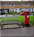 Queen Elizabeth II pillarbox and a bench in High Street, Albrighton