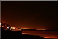 NZ8911 : The view from the east pier in Whitby - night by Oliver Mills