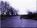 Gated access road to Somerby Wood