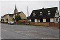 Main road houses and church spire, Stone, Gloucestershire