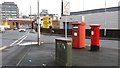 A pair of postboxes and a Lucy pillar