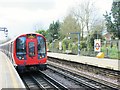 Metropolitan line train leaving Ickenham tube station