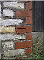 Benchmark on brick and stone