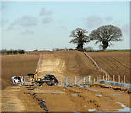 TF8915 : Underground cable traversing fields east of Beeston by Evelyn Simak