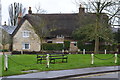 Thatched cottage opposite the school at Stoke Bruerne