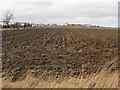 NZ3474 : Ploughed field north of Whitley Bay by Graham Robson