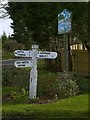 SK9303 : Fingerpost and village sign, North Luffenham by Alan Murray-Rust