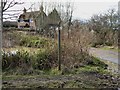 Signpost and cottage on Parthings Lane