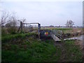SK4930 : Sluice and footbridge by Ian Calderwood