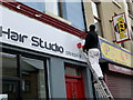 H4572 : Painter at work above Claire's Hair Studio, Omagh by Kenneth  Allen