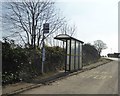 Bus stop and shelter by A30 near Whitecross