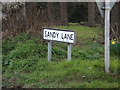 TM1353 : Sandy Lane sign by Geographer