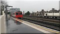 Westbound train departing Chiswick Park Station