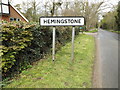 TM1352 : Hemingstone Village Name sign on Sandy Lane by Geographer