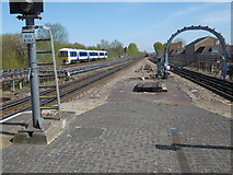 TQ1085 : A Chiltern train passes Ruislip Gardens Underground station by Marathon