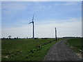 Track and wind turbine at Arglam