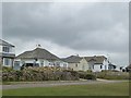 Houses and bungalows set back from Marine Drive, Widemouth Bay