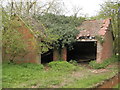 Derelict cow shed below Radford Barn