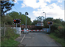 SK8316 : Whissendine Station level crossing and signal box by Andrew Tatlow