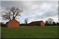 Field and stables by the church in Teigh