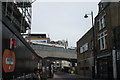 View of a London Overground train crossing Holywell Street