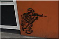 View of a gunman street art on Gatesborough Street