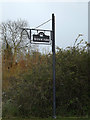 TM1853 : Manor Farm sign by Geographer